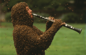 playing a clarinet covered in bees